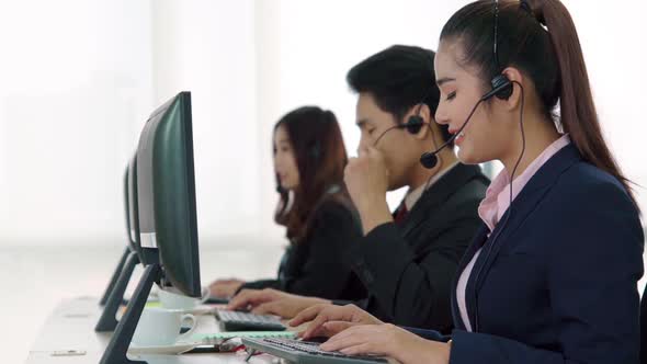 Business People Wearing Headset Working in Office