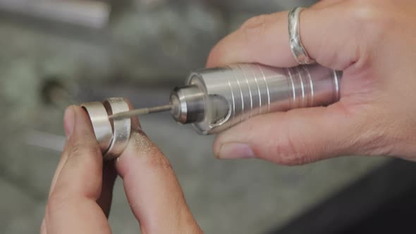 Hands of Jeweler Creating Ring