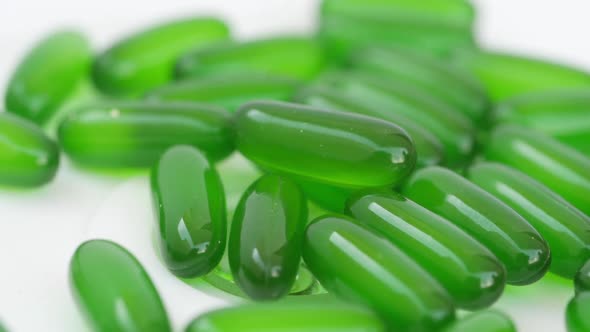 Rotating shot of green tablets, Close shot of green tablets with white background