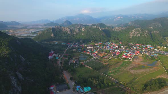 Aerial drone video of beautiful fishing seaside village. beautiful sea area in Thailand.