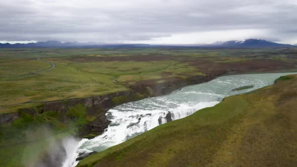 Gullfoss waterfalls in Iceland with drone video low and moving down.