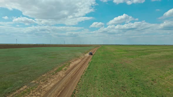 Aerial Drone View From Above on Car Moving By Rustic Road