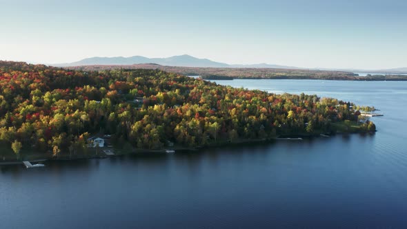 Aerial Blue Still Water in Autumn Forest Lake with Foliage Trees Moosehead Lake