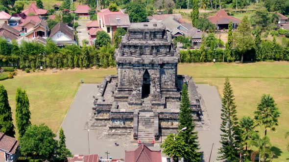 Facade of ancient Mandut temple in Buddhist monastery on Java, Indonesia, aerial