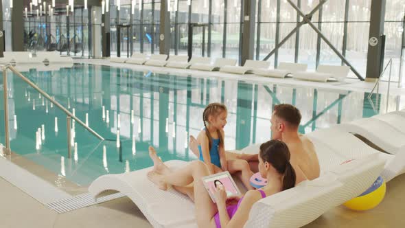 Happy Family By Pool Indoors