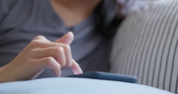 Close up of woman use of smart phone at home