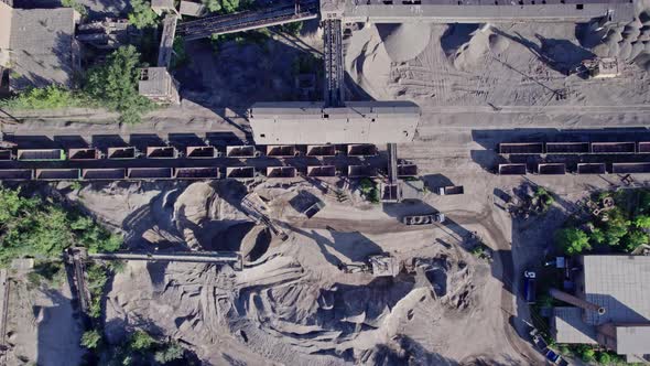 The Excavator Loads the Crushed Stone in a Truck