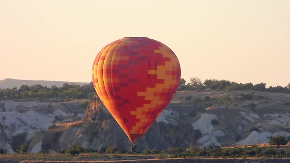 Hot Air Balloon Flying Over Hoodoos and Fairy Chimneys in Goreme Valley Cappadocia, Urgup Turkey