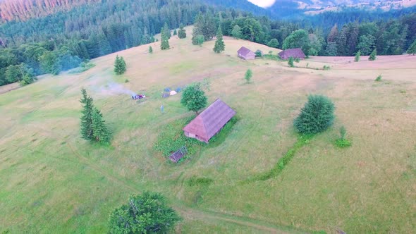 Aerial drone flight over mountain cabin