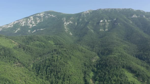 Ascending to top of the Serbian Rtanj mountain by early morning 4K drone footage