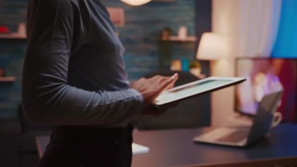 Closeup Photo of Black Female Hands Holding Tablet and Typing