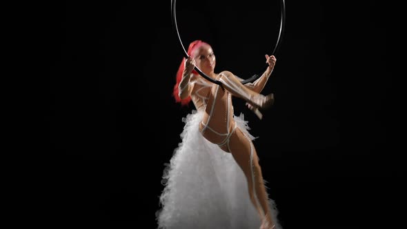 Wide Shot Slim Skilled Woman in Stage Costume Hopping on Air Hoop in Slow Motion