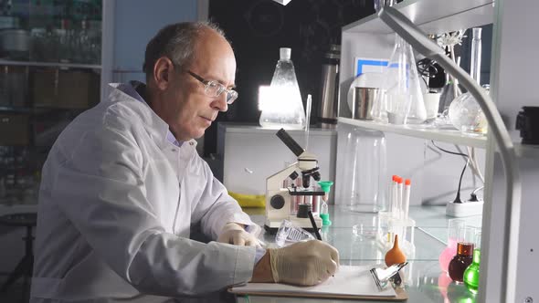 High Level Laboratory Scientist Examining Samples Test Tubes