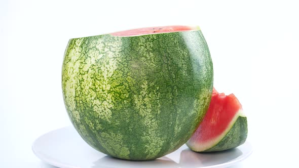 Red cut watermelon spinning in a circle.