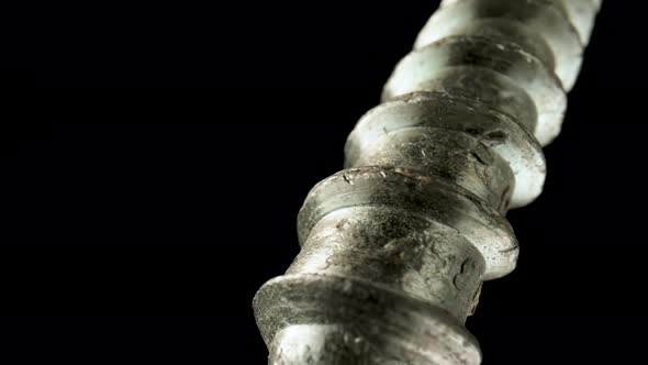 Part of a Stainless Spiral Screw Thread on an Isolated Black Background