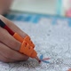 Close-up hand of a child holding a pencil - VideoHive Item for Sale