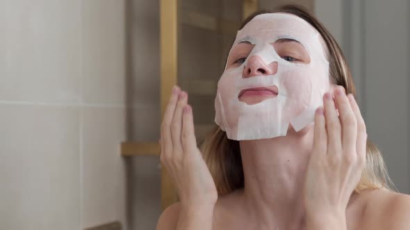 Young Woman Doing Purifying Mask on Her Face