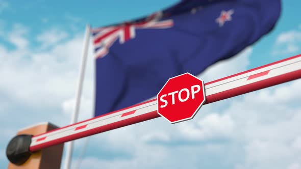 Opening Boom Barrier with Stop Sign Against the Flag of New Zealand