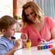 Happy Mother and Son Paint Easter Eggs at Home Together - VideoHive Item for Sale