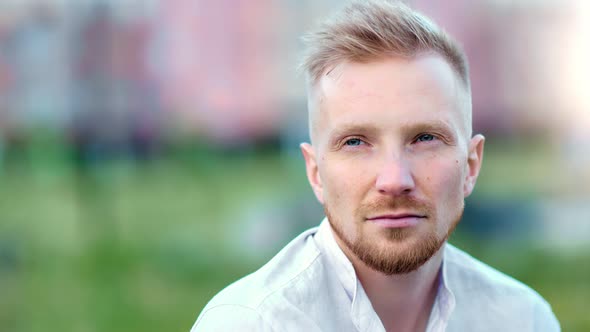 Pensive Calmness Young European Bearded Guy Thinking Relaxing at Summer Park Outdoor Closeup