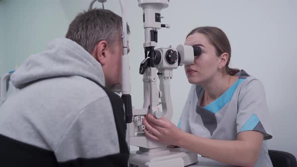 Ophthalmologist and Patient Testing Eyesight