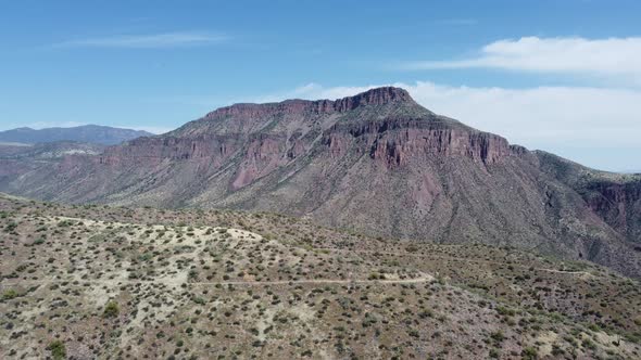 Drone shot of Arizona mountains and desert with cactus.