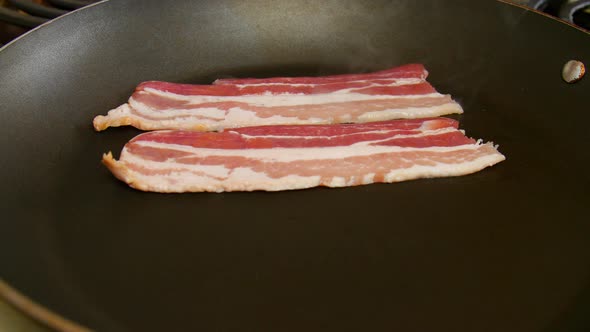 Cooking Strips of Bacon on the Stove