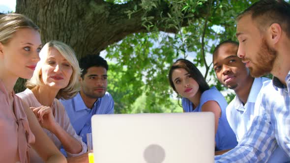 Group of friends using laptop