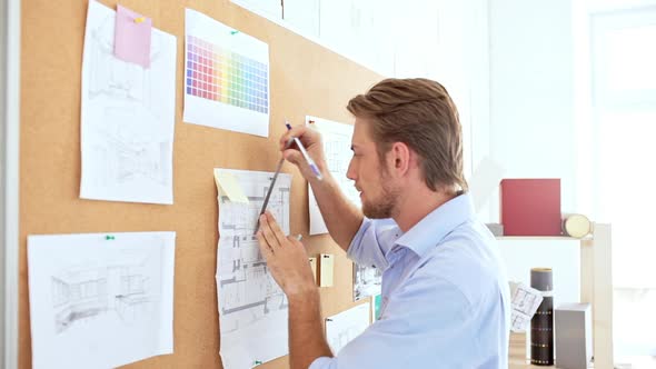 Architector Standing Near Board Measure Dimensions on Drawing Slow Motion