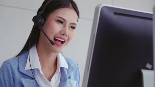 Customer Support Agent or Call Center with Headset Talking to Customer on Phone