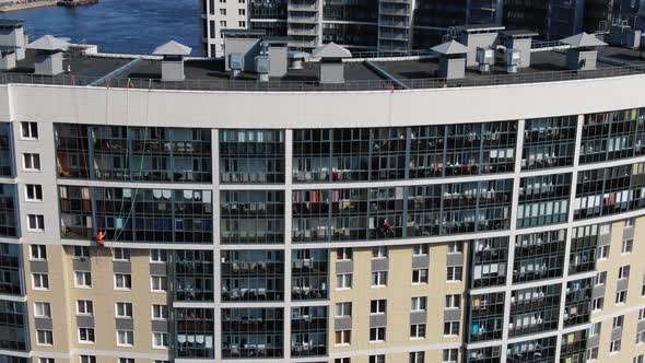 Skilled Industrial Climbers Wash Windows on Office Facade