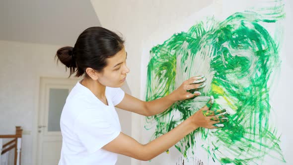 Professional Girl Artist Draws Green Yellow White Paints