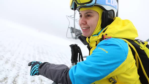 Woman Vlogger Talking While Going Up on Ski Lift