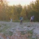 Young Parents with Three Children Walk Along a Mountain Path at Sunset - VideoHive Item for Sale