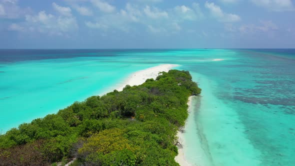 Daytime drone copy space shot of a white paradise beach and turquoise sea background in high resolut