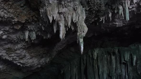 Underground Cave with Stalactite Rock Formations Hanging From Kuza Cave Ceiling