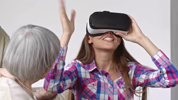 Amazed Young Woman in Virtual Reality Glasses