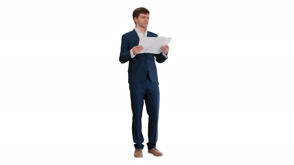 Businessman Reading Documents or Report on White Background