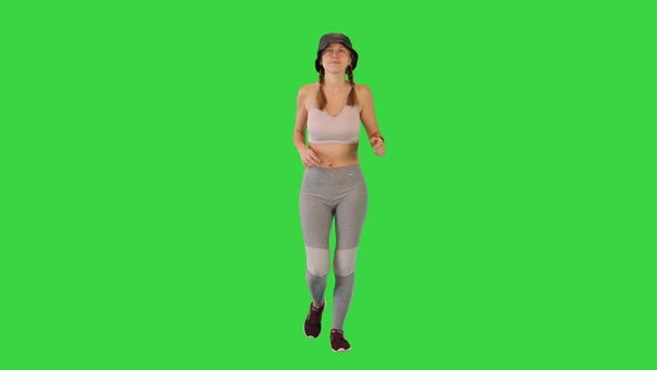 Young Woman in Sport Clothes Running in Panama on a Green Screen Chroma Key