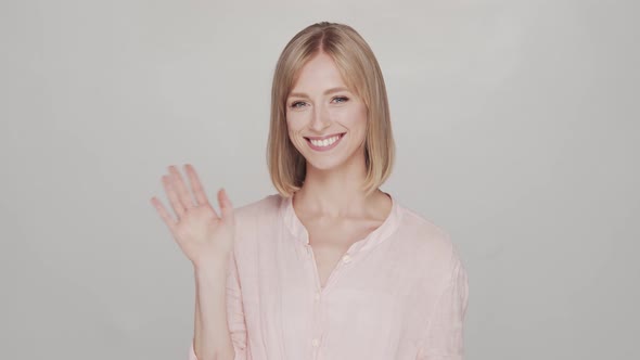 Studio portrait of young, beautiful and natural blond woman.