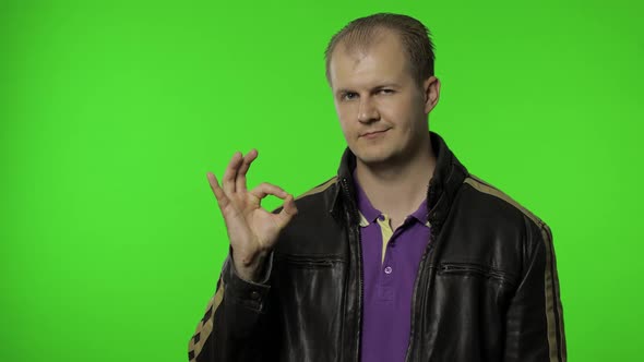 Man Showing Ok Gesture, Smiling with Optimistic Satisfied Expression, Winking, Okay Sign of Approval