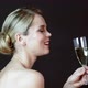 Beautiful young woman toasting and drinking champagne - VideoHive Item for Sale