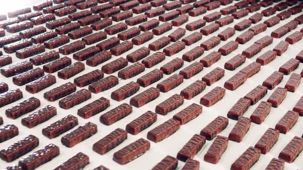 Large Conveyor Belt with Plenty on Chocolate Candy Bars