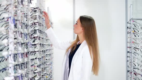 Woman Buyer Choosing New Eyeglasses