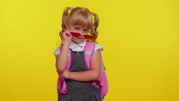 Playful Happy Teen Child Kid Girl in School Uniform Winking Eye Looking at Camera with Smile