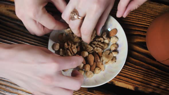 A Plate with Hazelnuts and Nuts