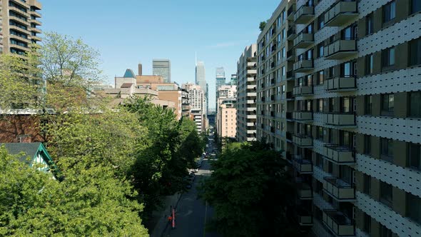 4K Cinematic urban drone footage of an aerial view of a street in the middle of downtown Montreal, Q