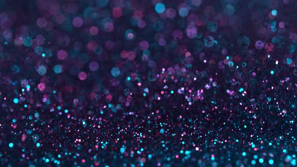 Super Slow Motion Shot of Neon Glitter Background at 1000Fps