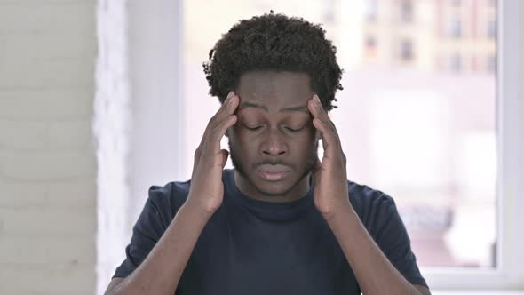 Portrait of Tired Young African American Man Having Headache