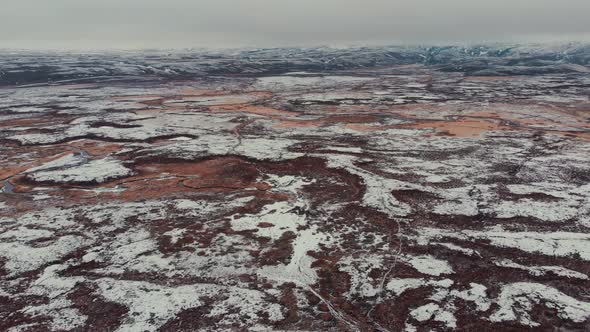 Aerial view of road in terrain snowy